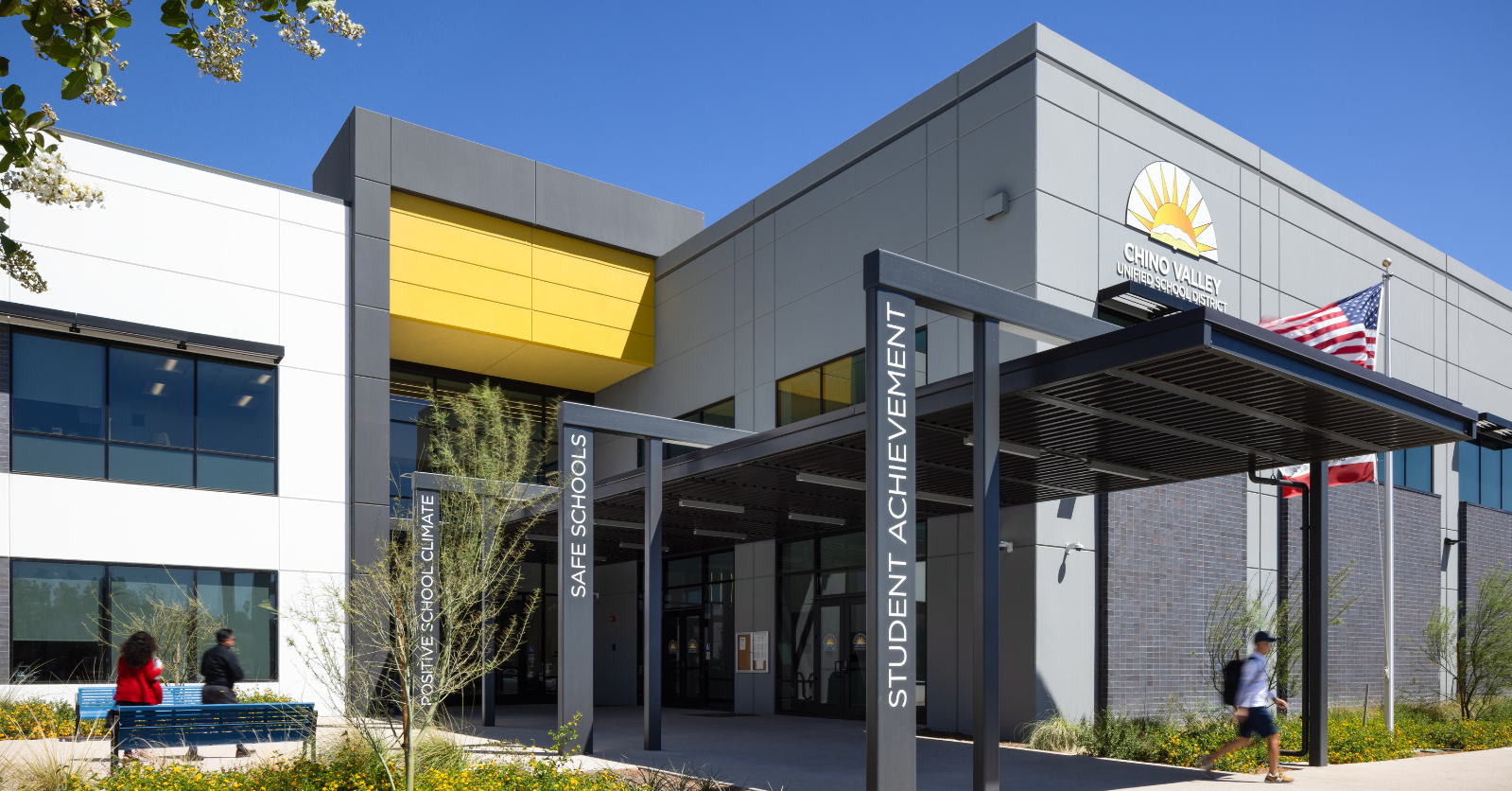 Chino Valley Unified School District office with yellow, white, and grey colors on the outside of the building with large entry way